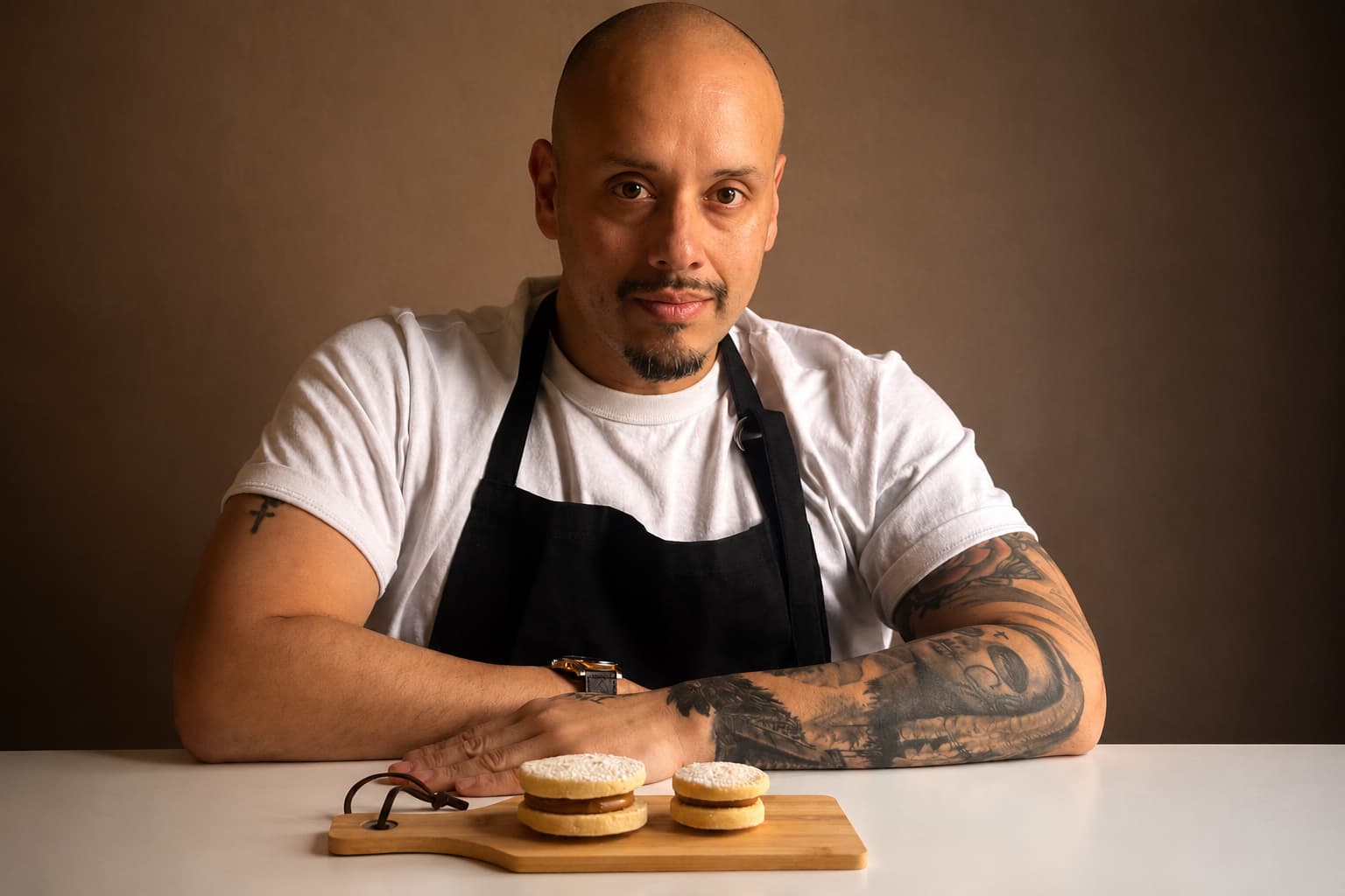 Luis, founder of Lucho Bakes, with his alfajores